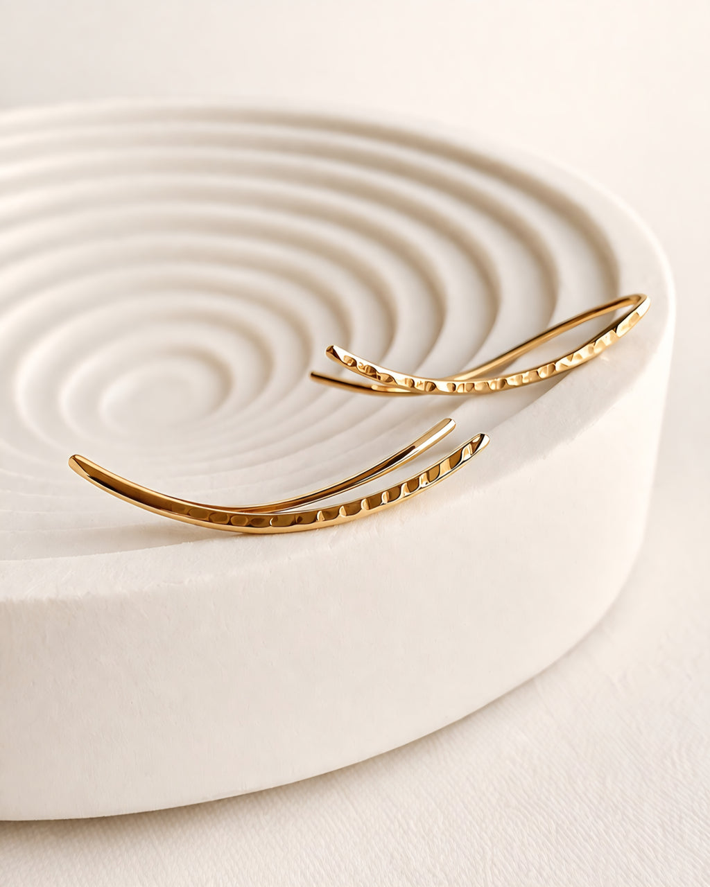 Hammered ear climber earrings with a polished 14K gold-plated finish.