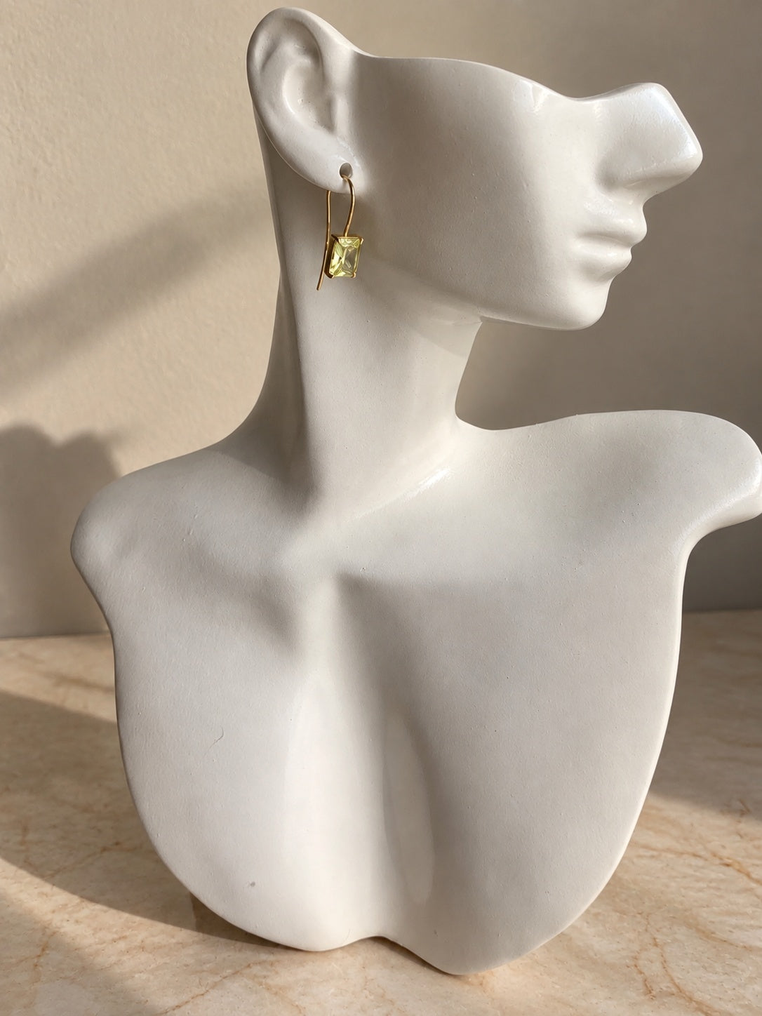 Rectangular peridot drop earrings in gold setting