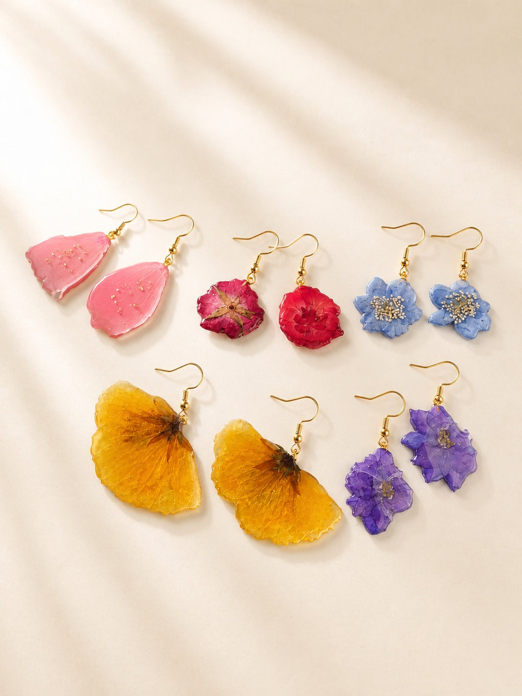 Real pressed flower earrings with genuine preserved flowers and 14K gold-plated hooks.