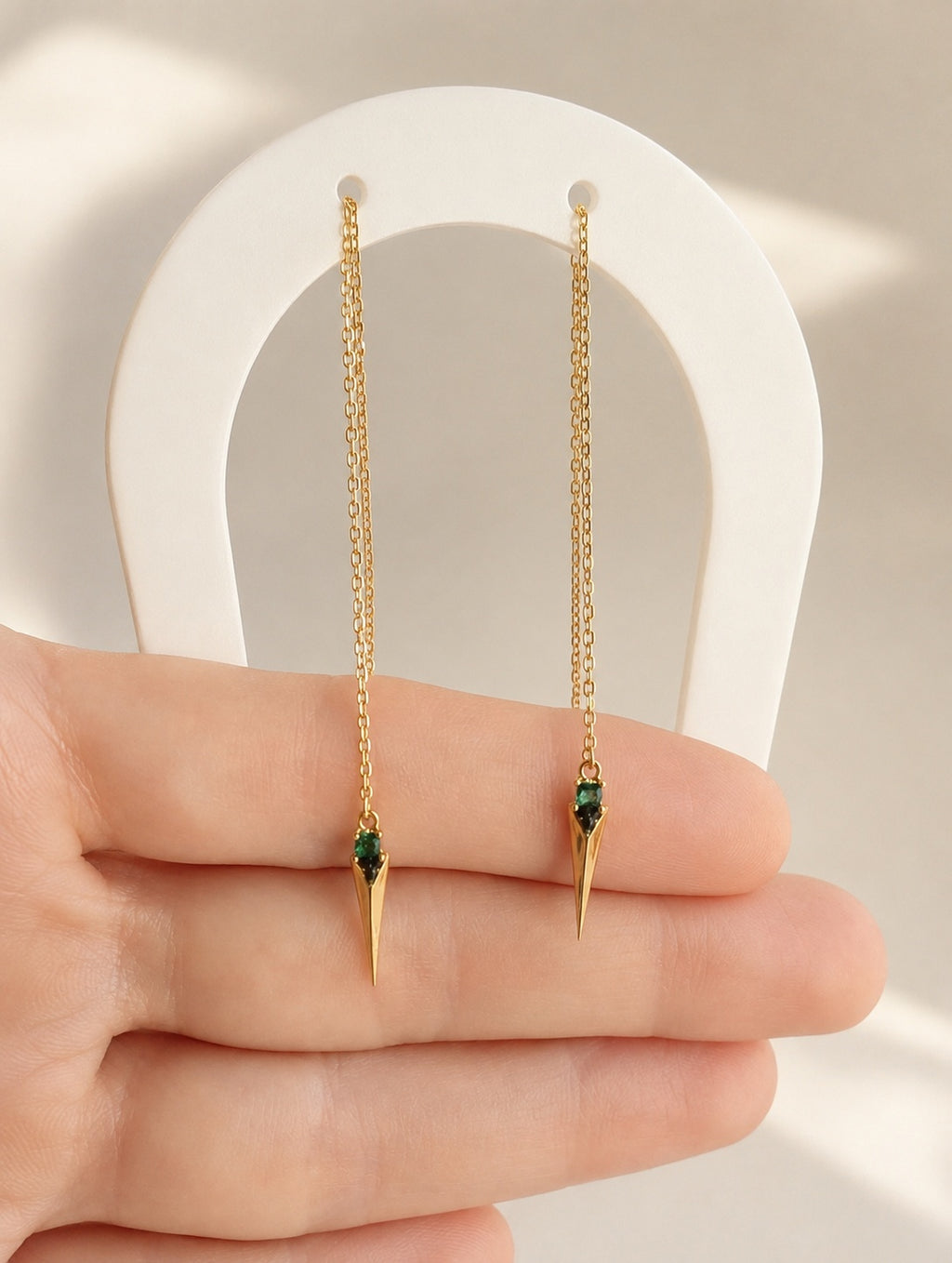 Emerald spike threader earrings crafted from 925 sterling silver with 18K gold plating.
