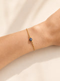 Dainty Evil Eye bracelet available in gold and silver finishes.