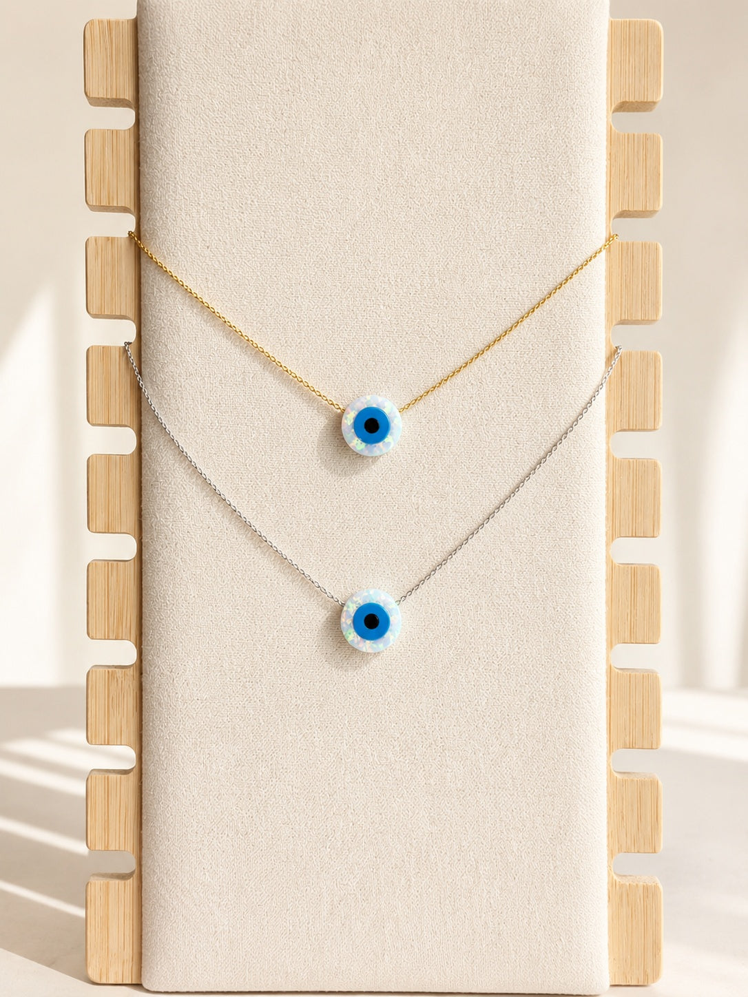 Necklace with evil eye featuring a lab-created opal pendant on a 925 sterling silver chain.