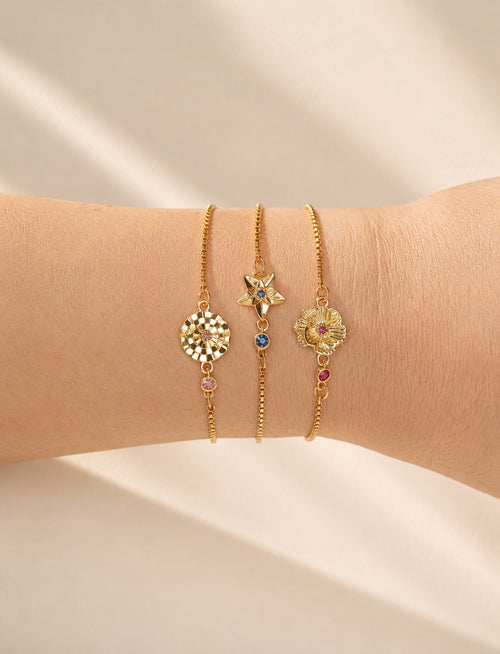 Birth flower bracelet with an engraved floral charm and matching birthstone.
