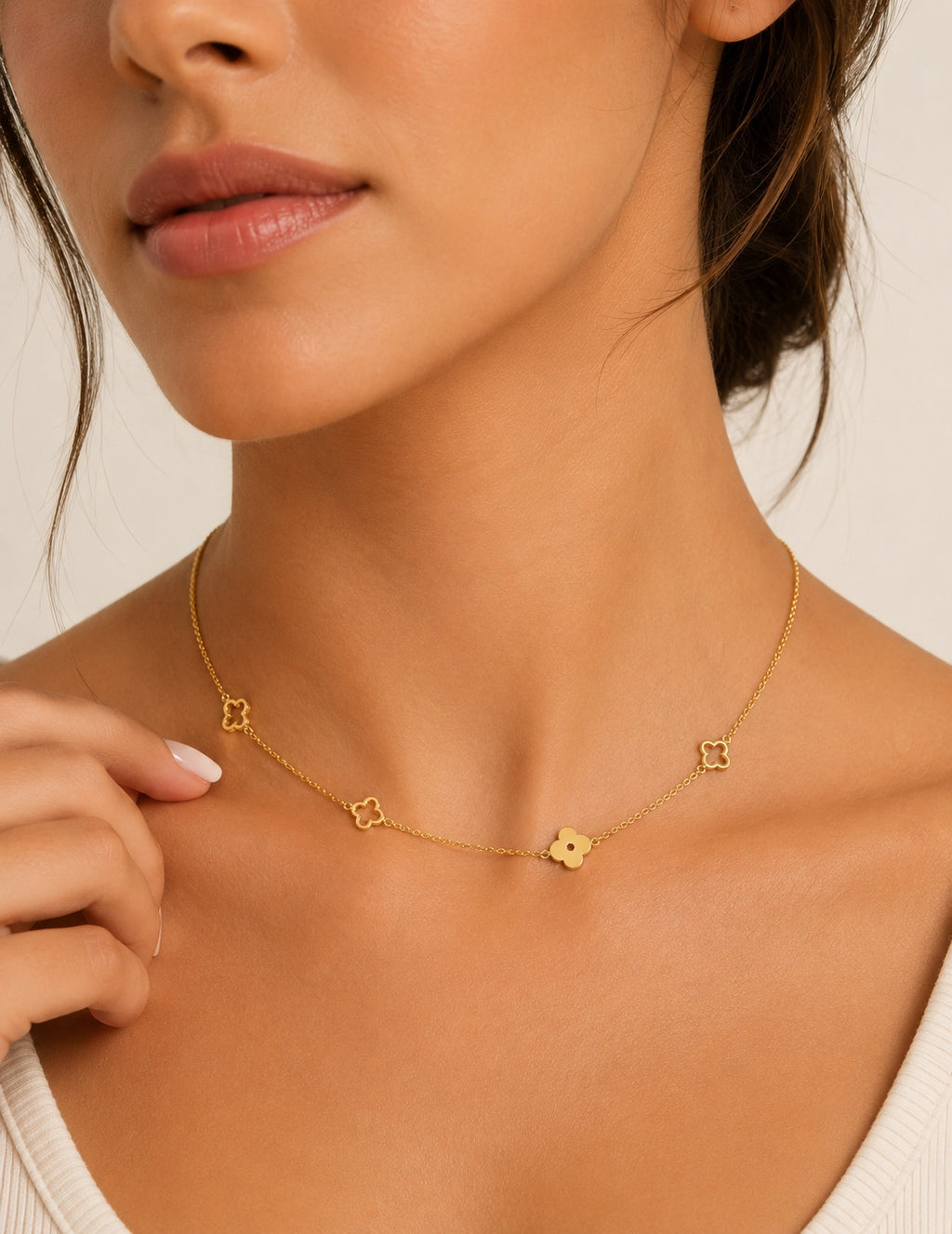 Dainty floral clover necklace featuring a polished 18K gold-plated chain.