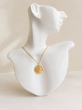 Sun Moon rotating necklace with an 18K gold-plated celestial spinner pendant.