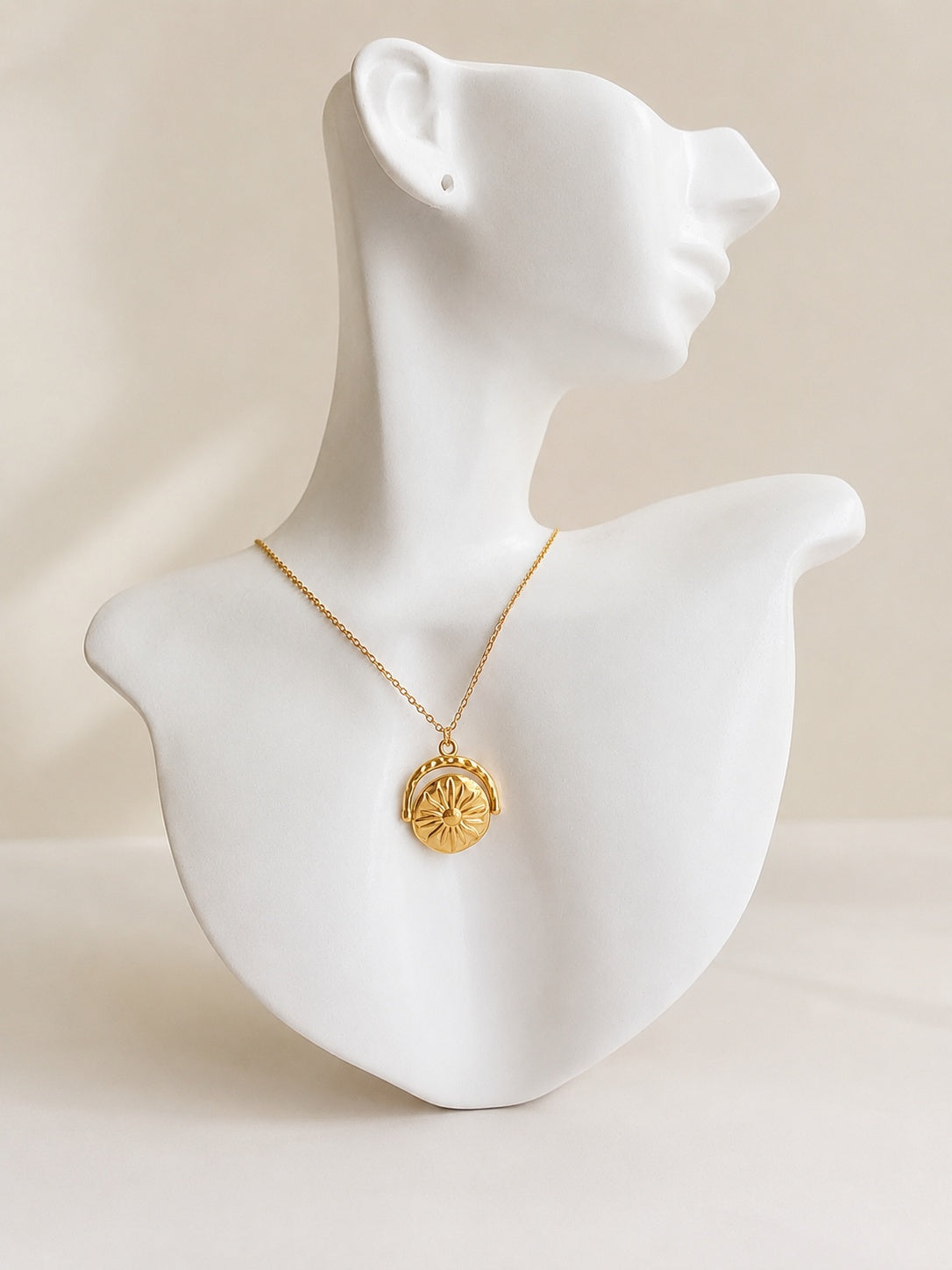 Sun Moon rotating necklace with an 18K gold-plated celestial spinner pendant.
