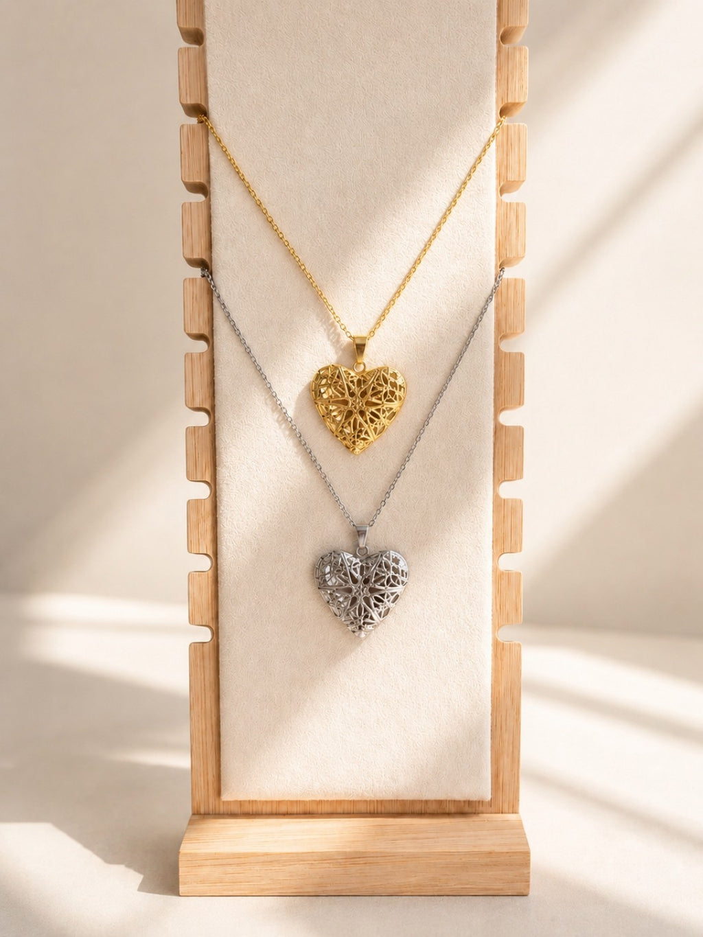 Elegant gold heart locket necklace with a detailed keepsake pendant.