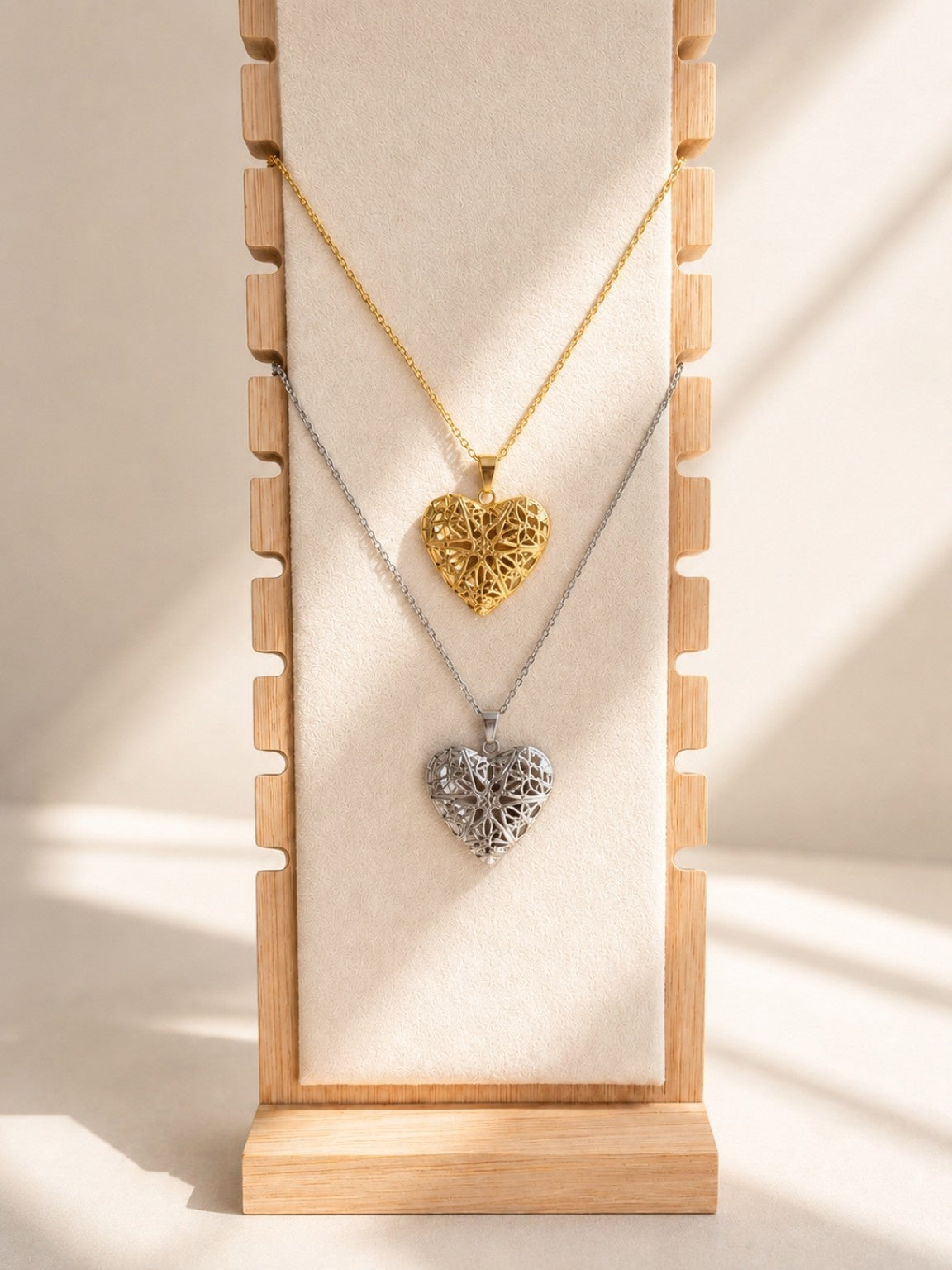 Elegant gold heart locket necklace with a detailed keepsake pendant.