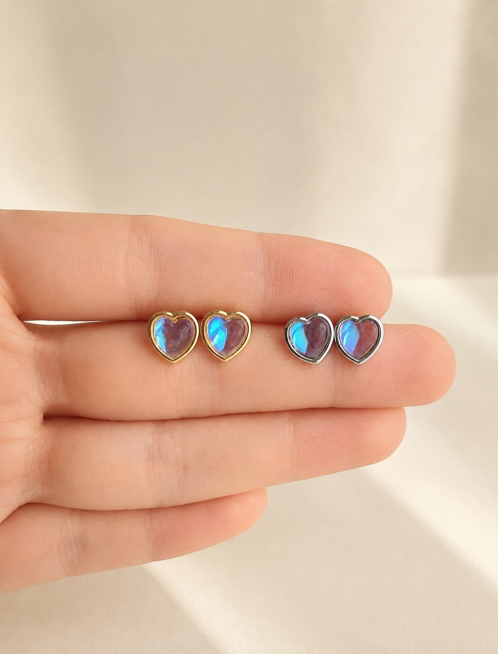 Heart moonstone stud earrings with a 14K gold-plated finish.