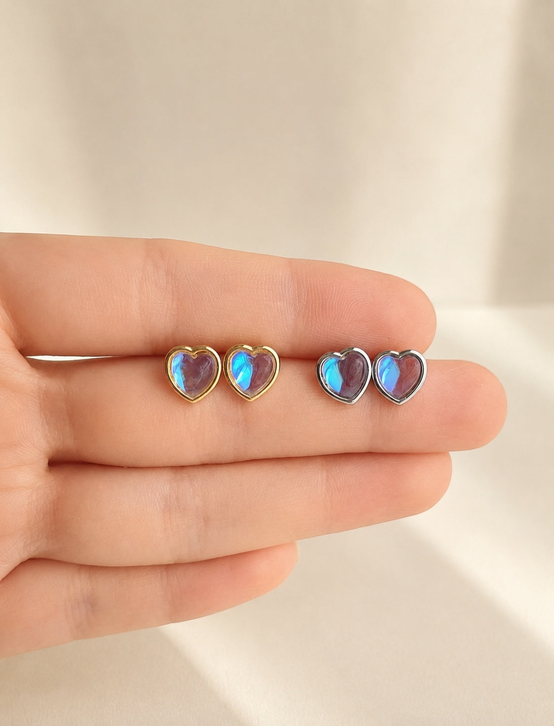 Heart moonstone stud earrings with a 14K gold-plated finish.