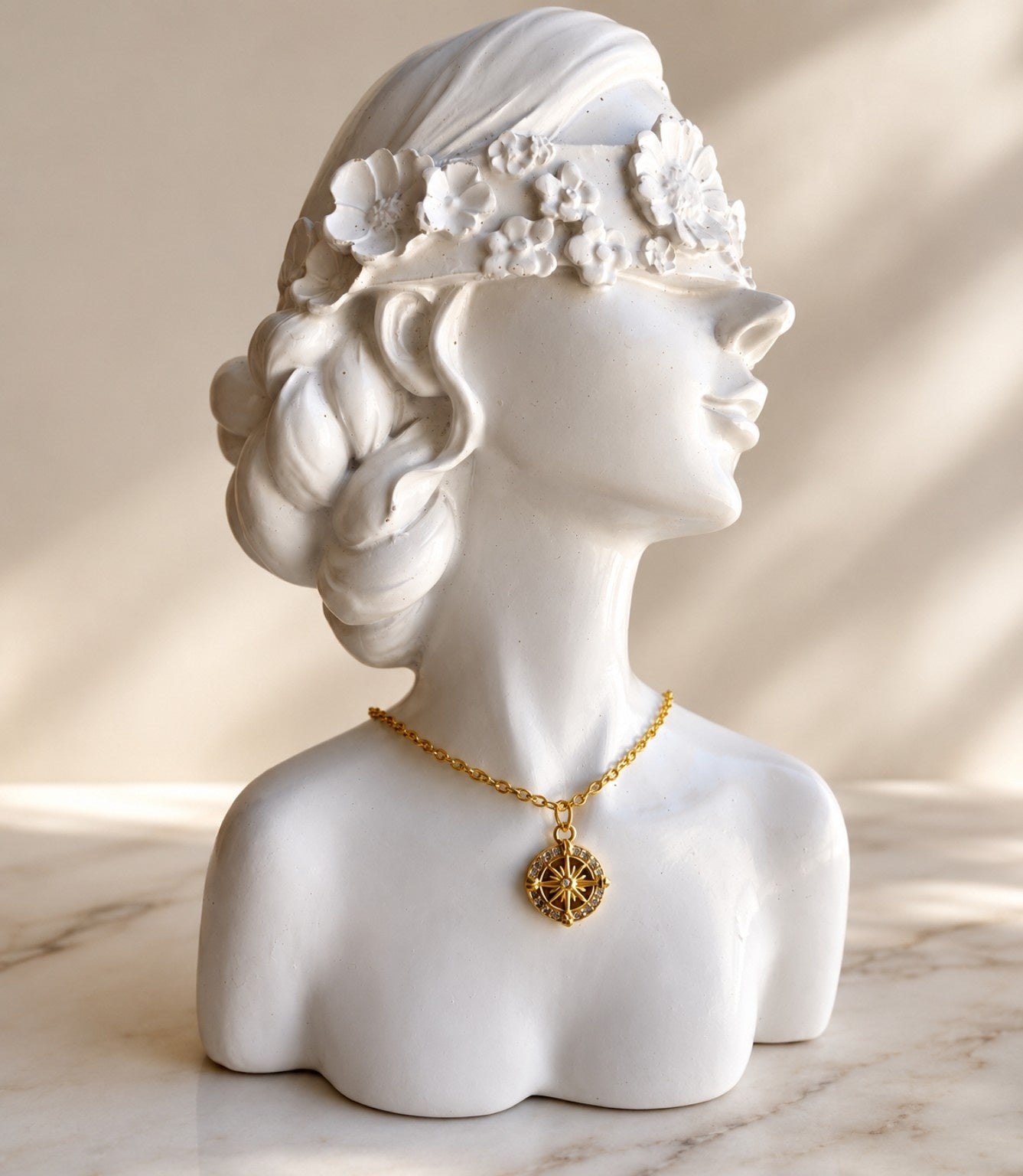 Compass necklace with an 18K gold-plated North Star pendant.