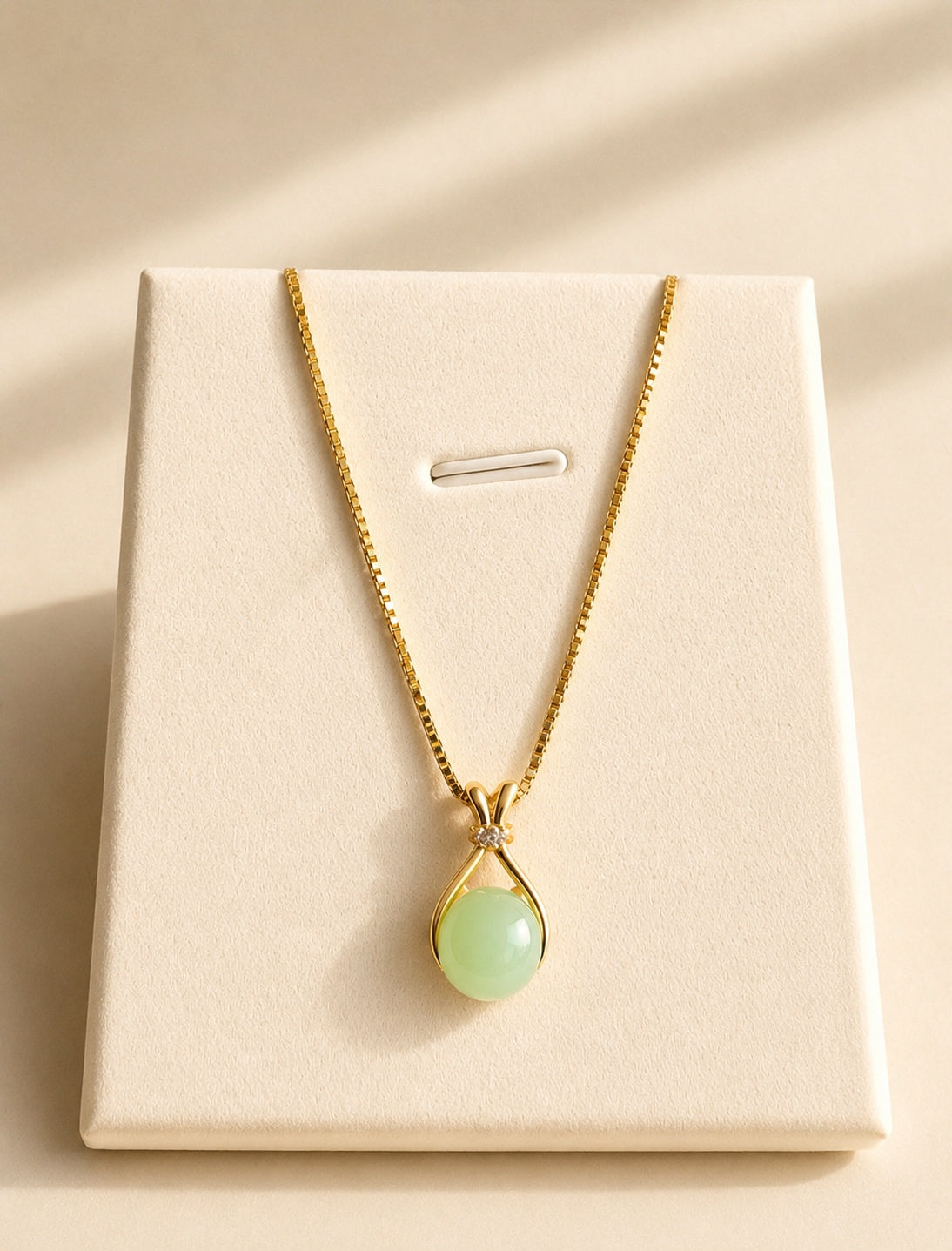 Elegant gold-plated necklace featuring a genuine green jade pendant.