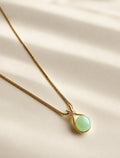 Green jade pendant necklace with a polished 14K gold-plated chain.