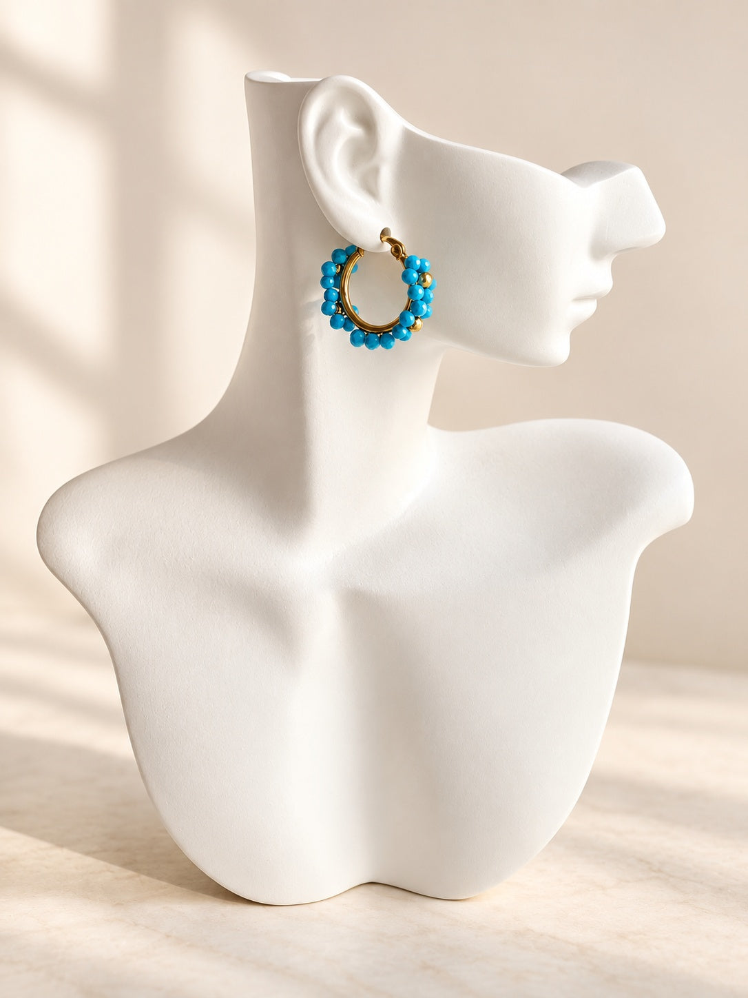 Turquoise statement hoop earrings in gold