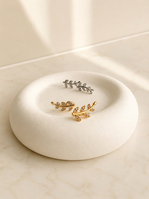 Botanical ear climber earrings with a floral leaf vine design and CZ stones.