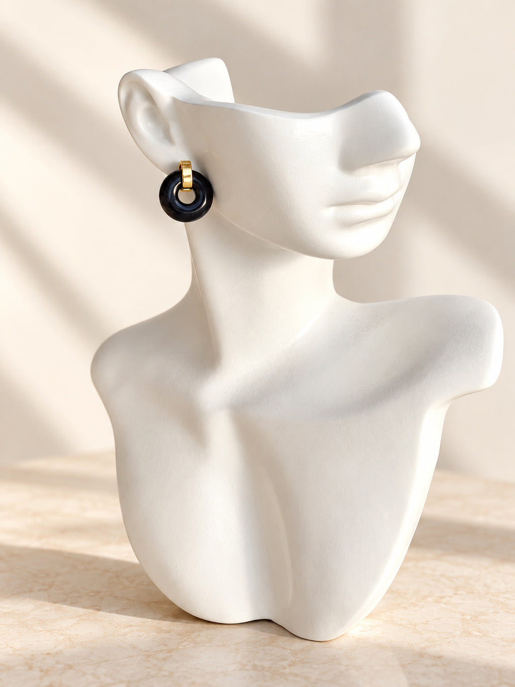 Glossy black agate earrings with gold plated detail