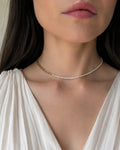 Paperclip tennis choker necklace with sparkling CZ stones and 18K gold plating.