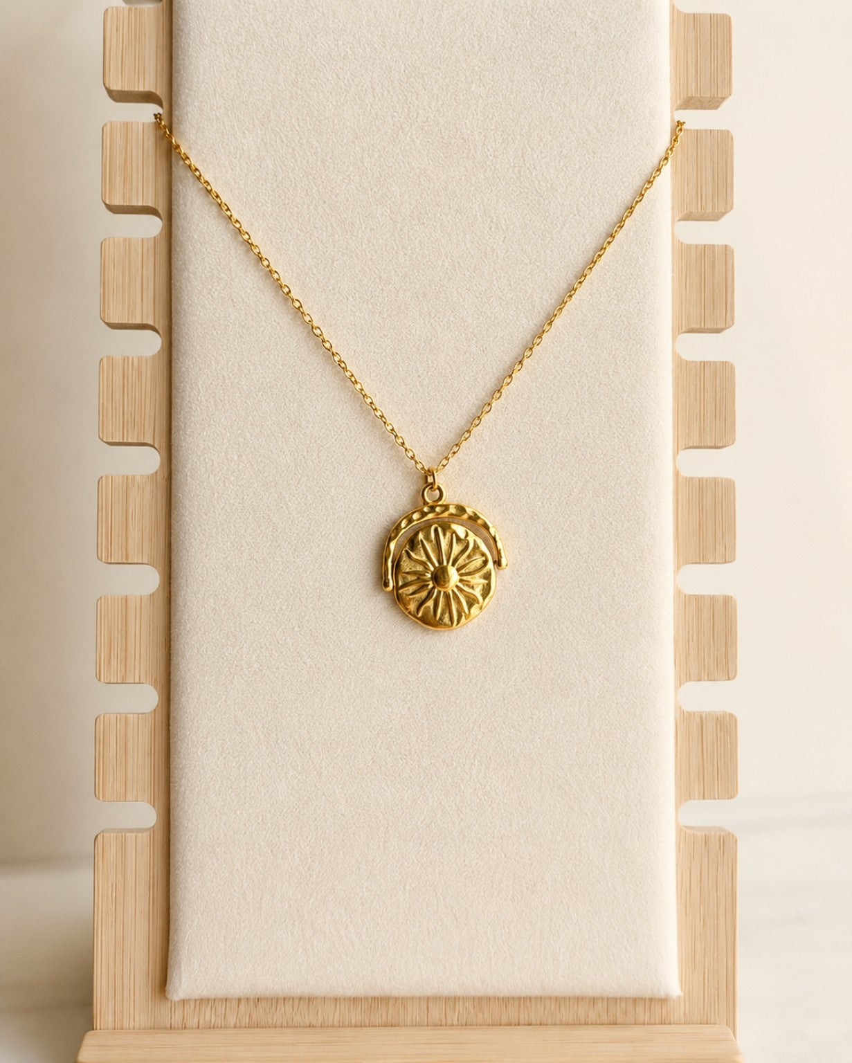 Gold rotating sun moon pendant necklace for everyday wear.