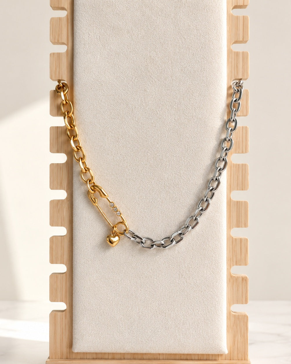 Mixed metal safety pin necklace with matching bracelet and heart charm.