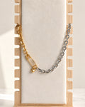 Mixed metal safety pin necklace with matching bracelet and heart charm.
