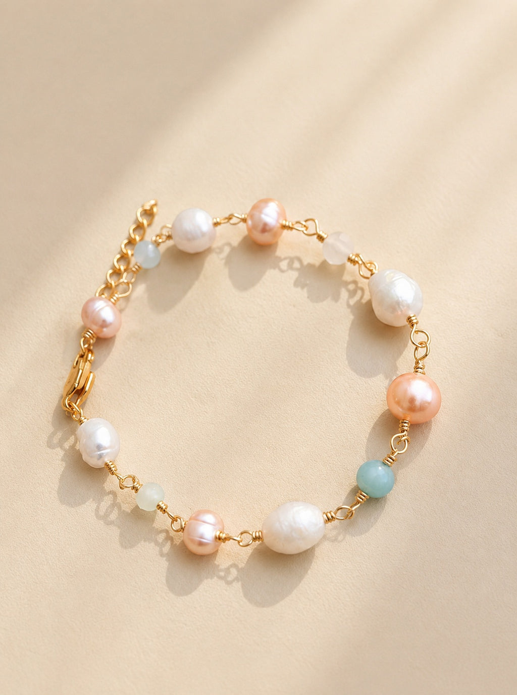Freshwater pearl and aquamarine beaded bracelet with 14K gold plating.