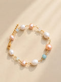 Freshwater pearl and aquamarine beaded bracelet with 14K gold plating.