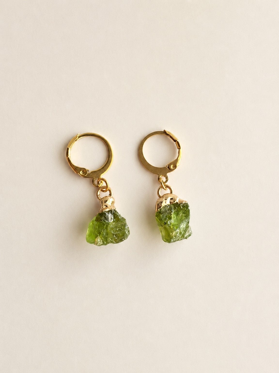 18K gold plated hoop earrings featuring genuine raw aquamarine crystals.