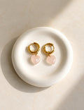 Rose quartz heart drop earrings with 18K gold plating and a non-tarnish finish.