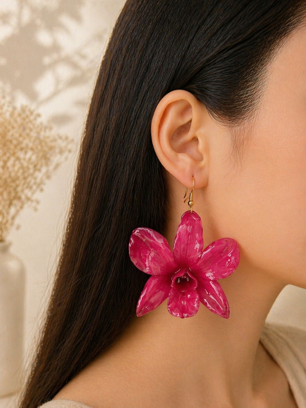 Real flower earrings with preserved orchid blooms and gold-plated hooks.