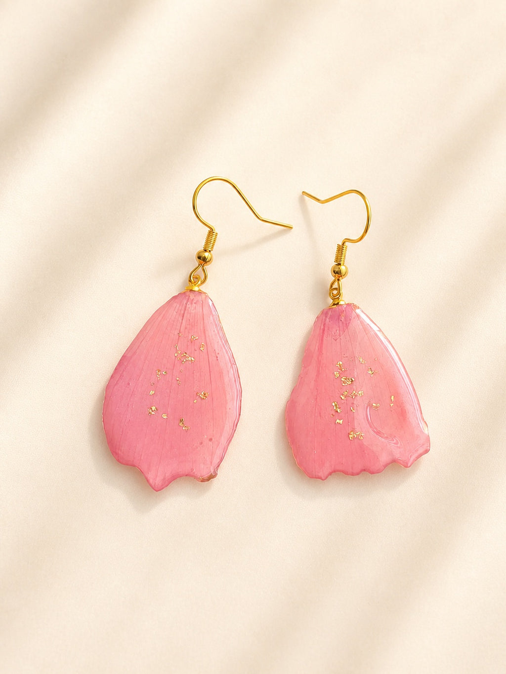 Pink cherry blossom pressed flower earrings with 14K gold-plated hooks.