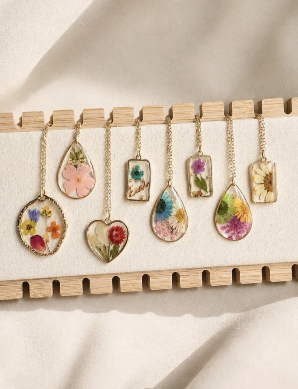 Real pressed flower necklace with genuine dried flowers in resin.