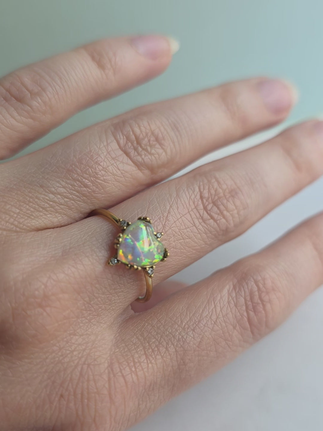 Heart-shaped opal ring with an adjustable 18K gold-plated non-tarnish band.