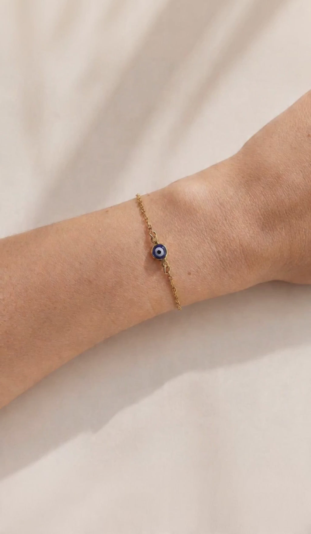 Delicate protection bracelet with an Evil Eye centerpiece and adjustable clasp.