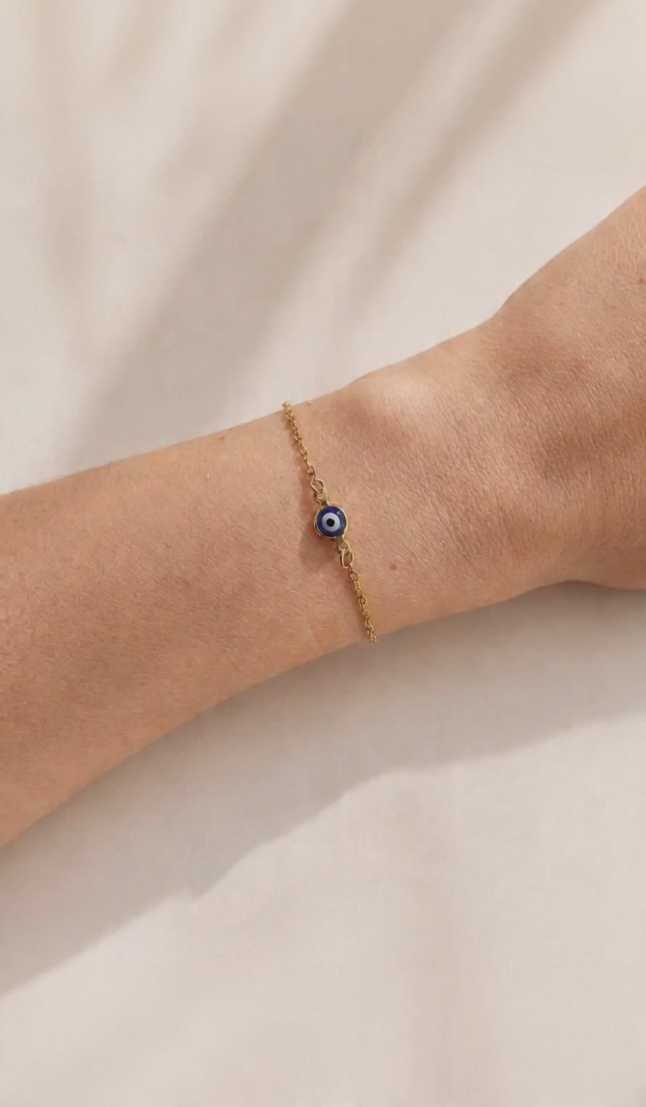 Delicate protection bracelet with an Evil Eye centerpiece and adjustable clasp.