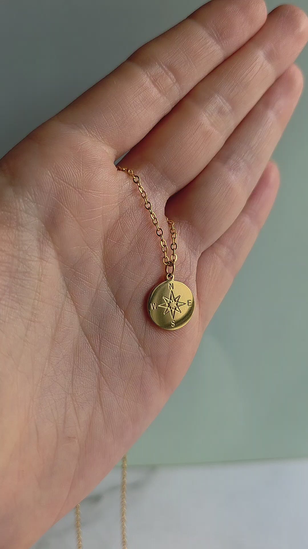 18K gold-plated compass necklace featuring an engraved North Star pendant, inspired by adventure, guidance, and new beginnings.