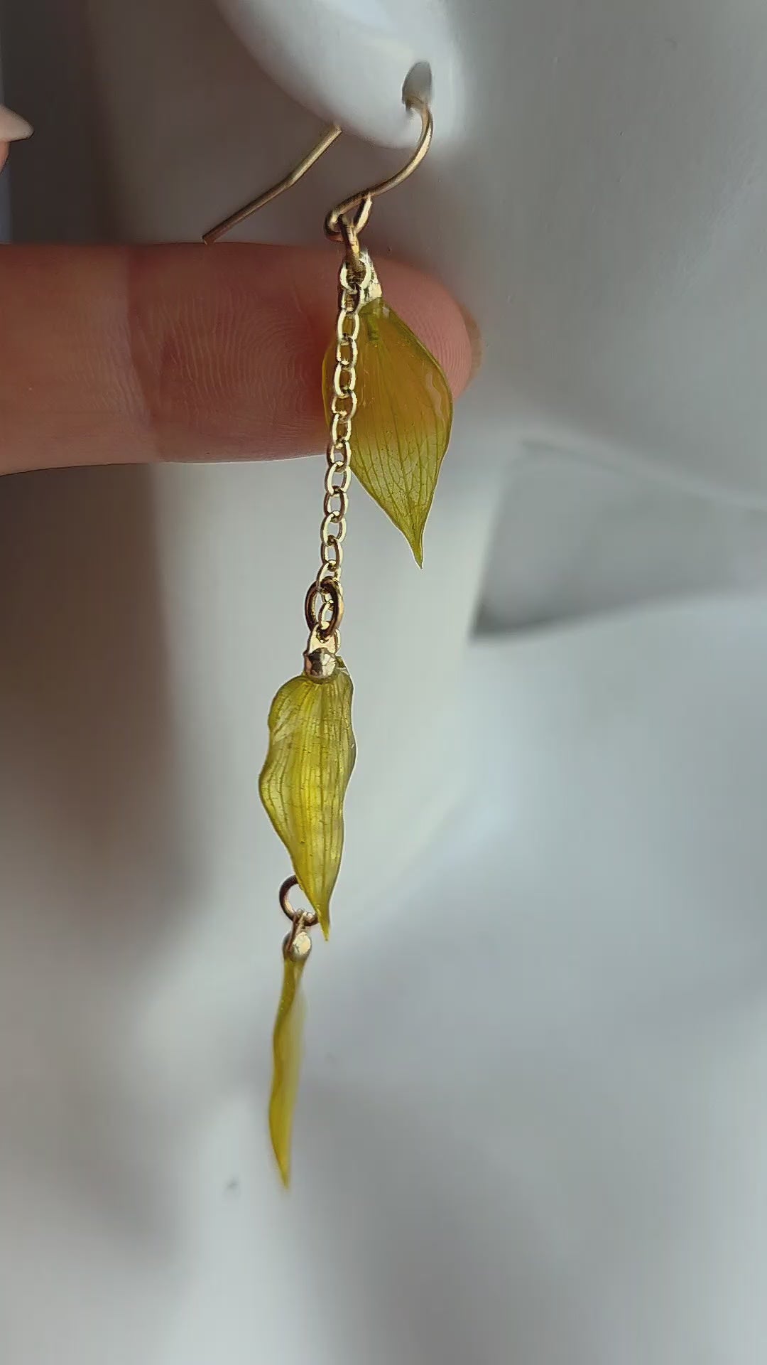 Real leaf earrings symbolizing growth and renewal