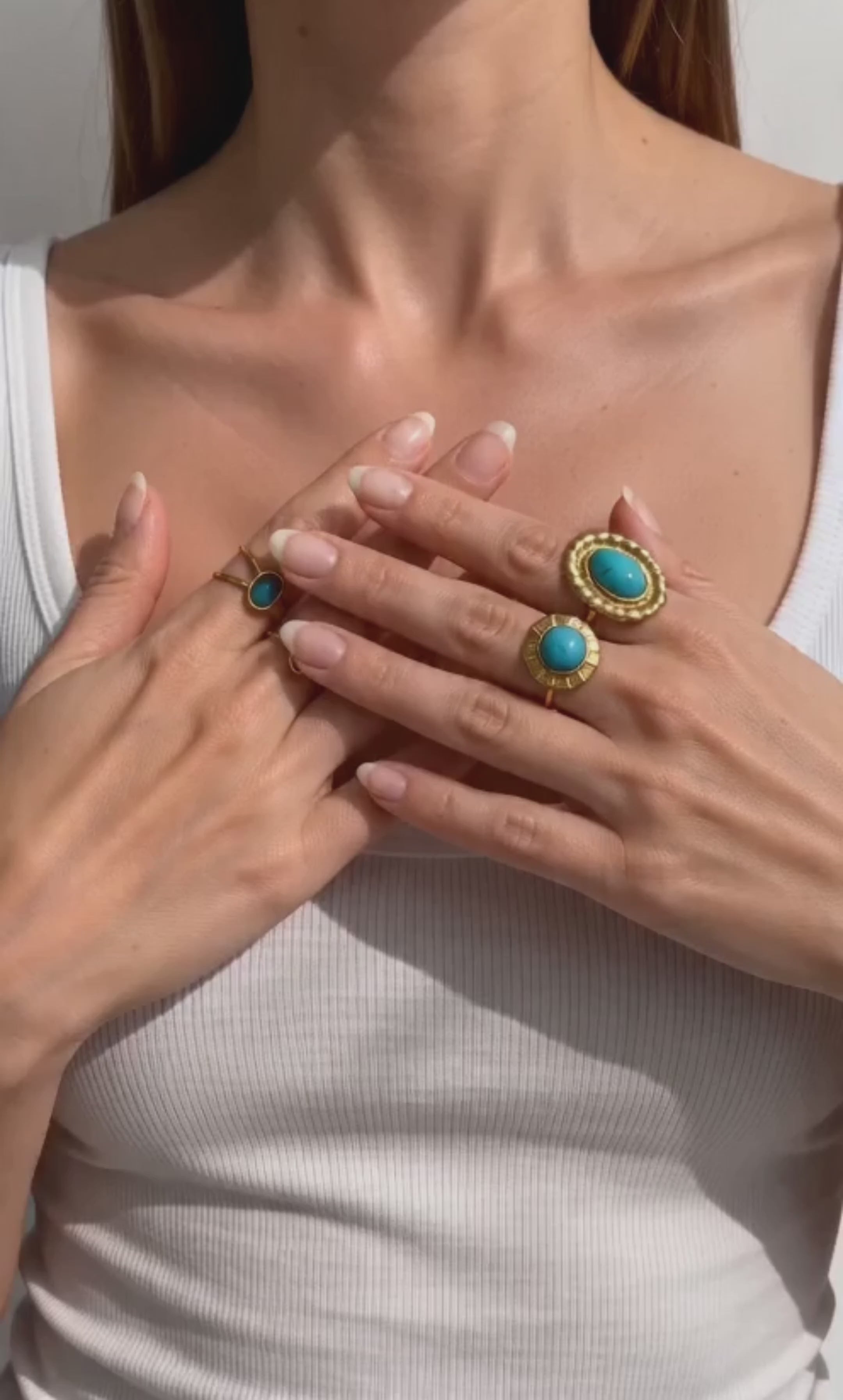 Chunky gold ring featuring a vibrant turquoise stone and polished finish.