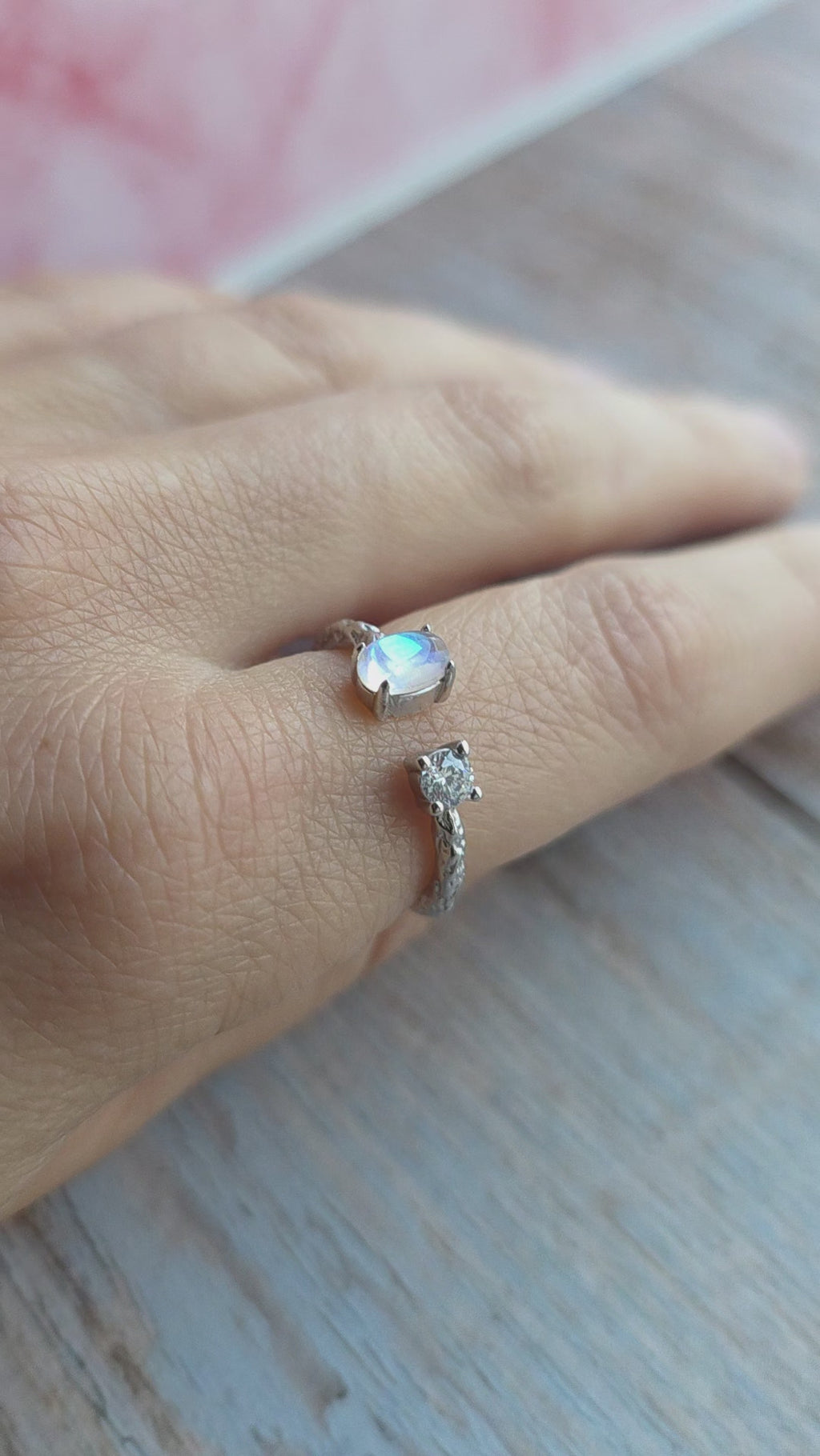 Gold-plated rainbow moonstone ring featuring a textured hammered band.