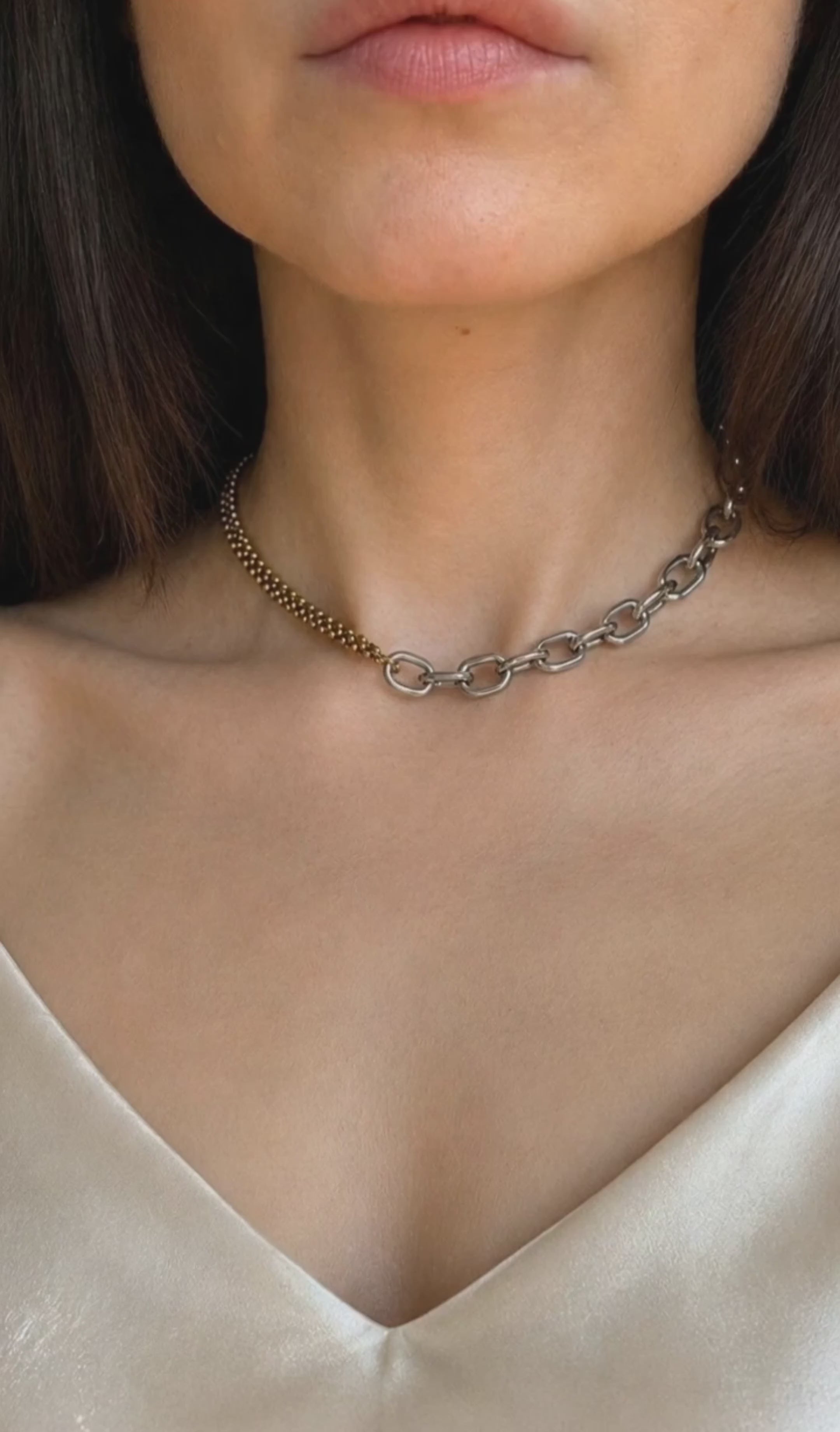Mixed metal necklace with a two-tone non tarnish chain, combining 18K gold plating and silver-tone links for a contemporary everyday look.