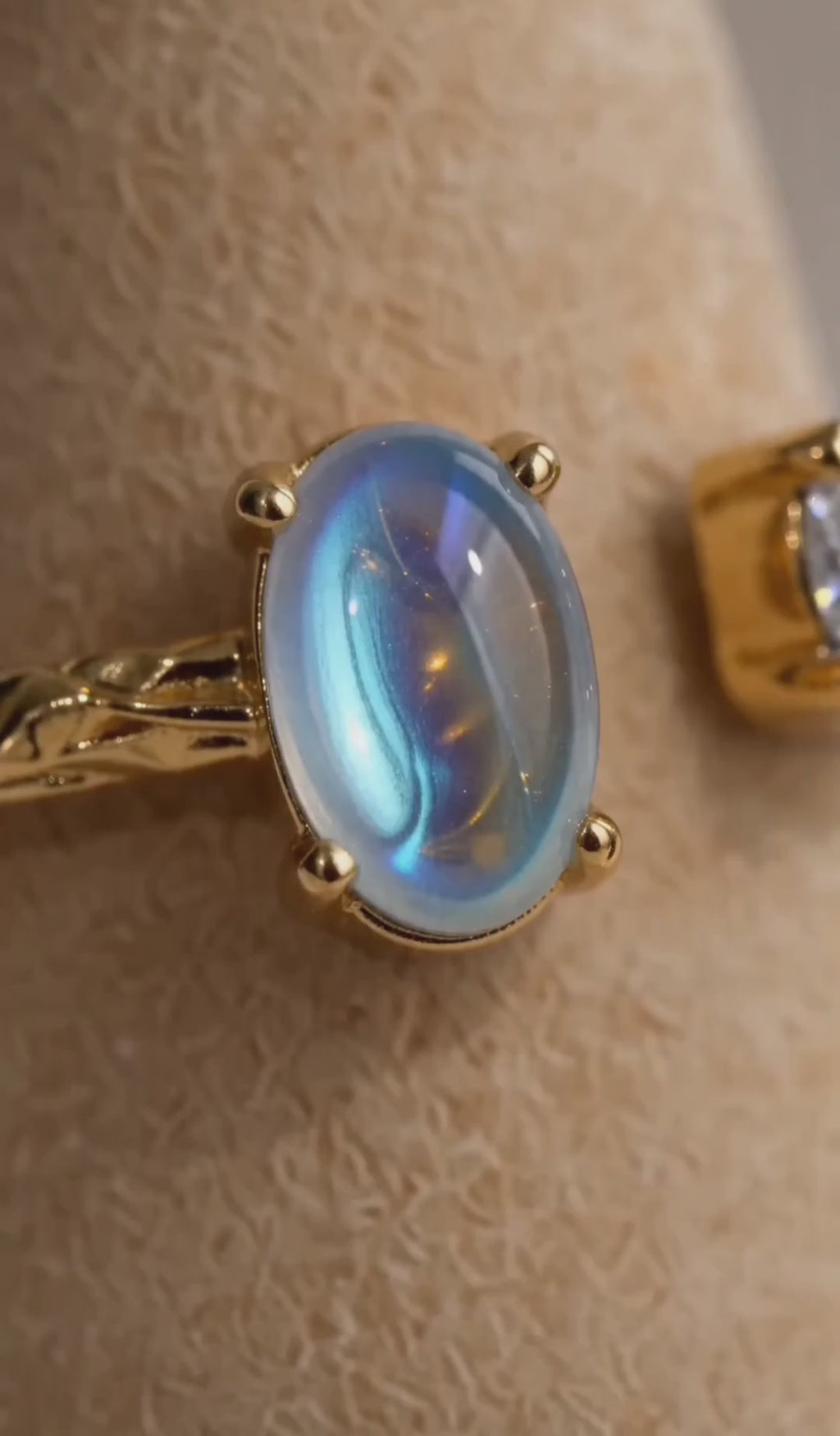 Adjustable rainbow moonstone ring crafted with a 925 sterling silver base.