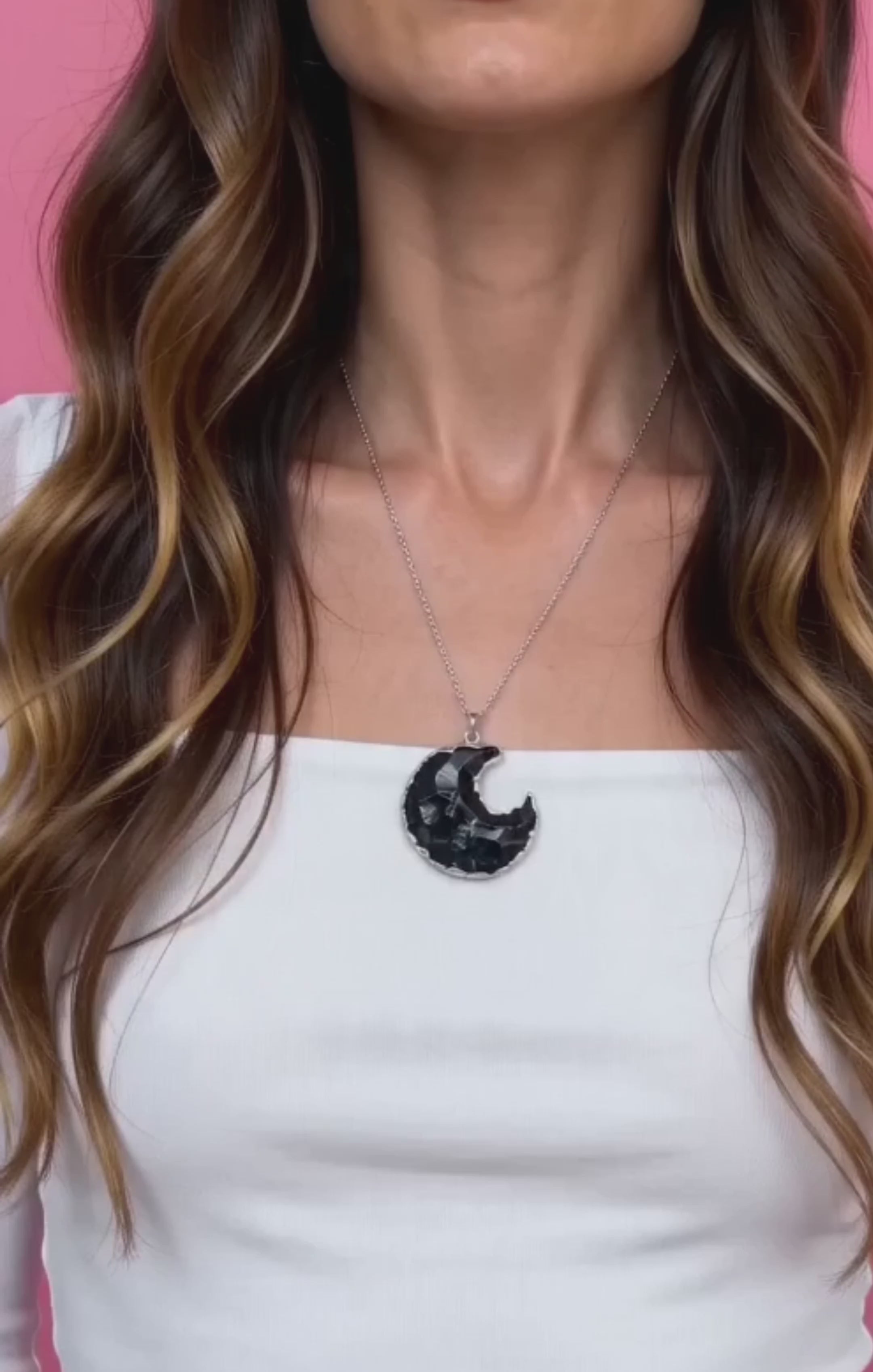 Black Obsidian moon necklace in gold and silver finishes.
