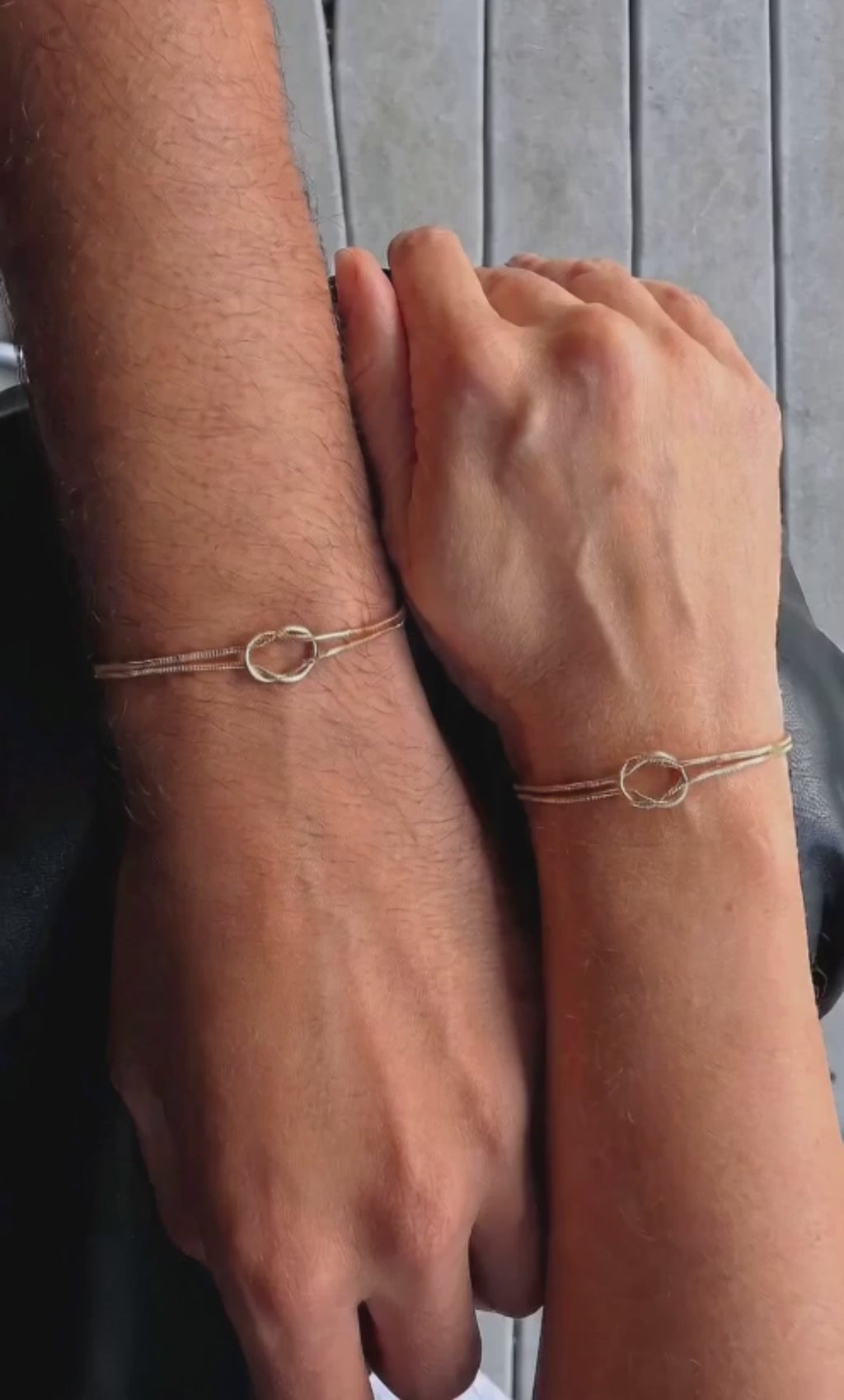 Minimalist his and hers love knot bracelet set with adjustable sliding chains.