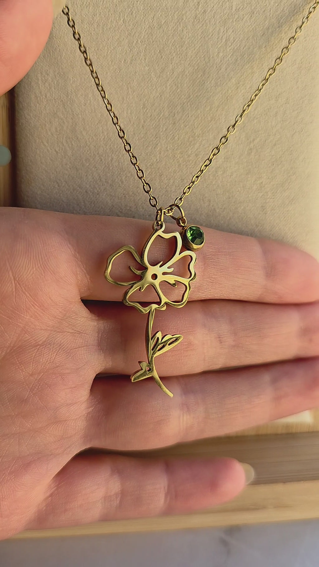 Elegant waterproof birth month necklace with engraved flower and matching birthstone.
