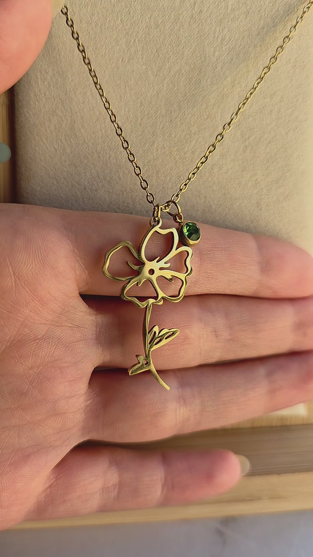 Elegant waterproof birth month necklace with engraved flower and matching birthstone.
