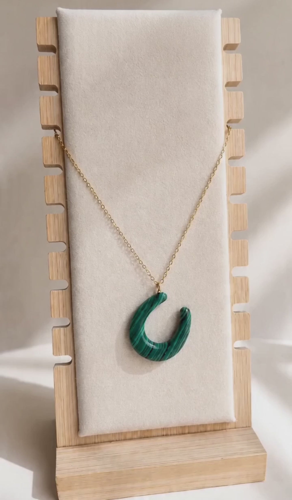 Malachite gemstone necklace with an 18K gold-plated chain.