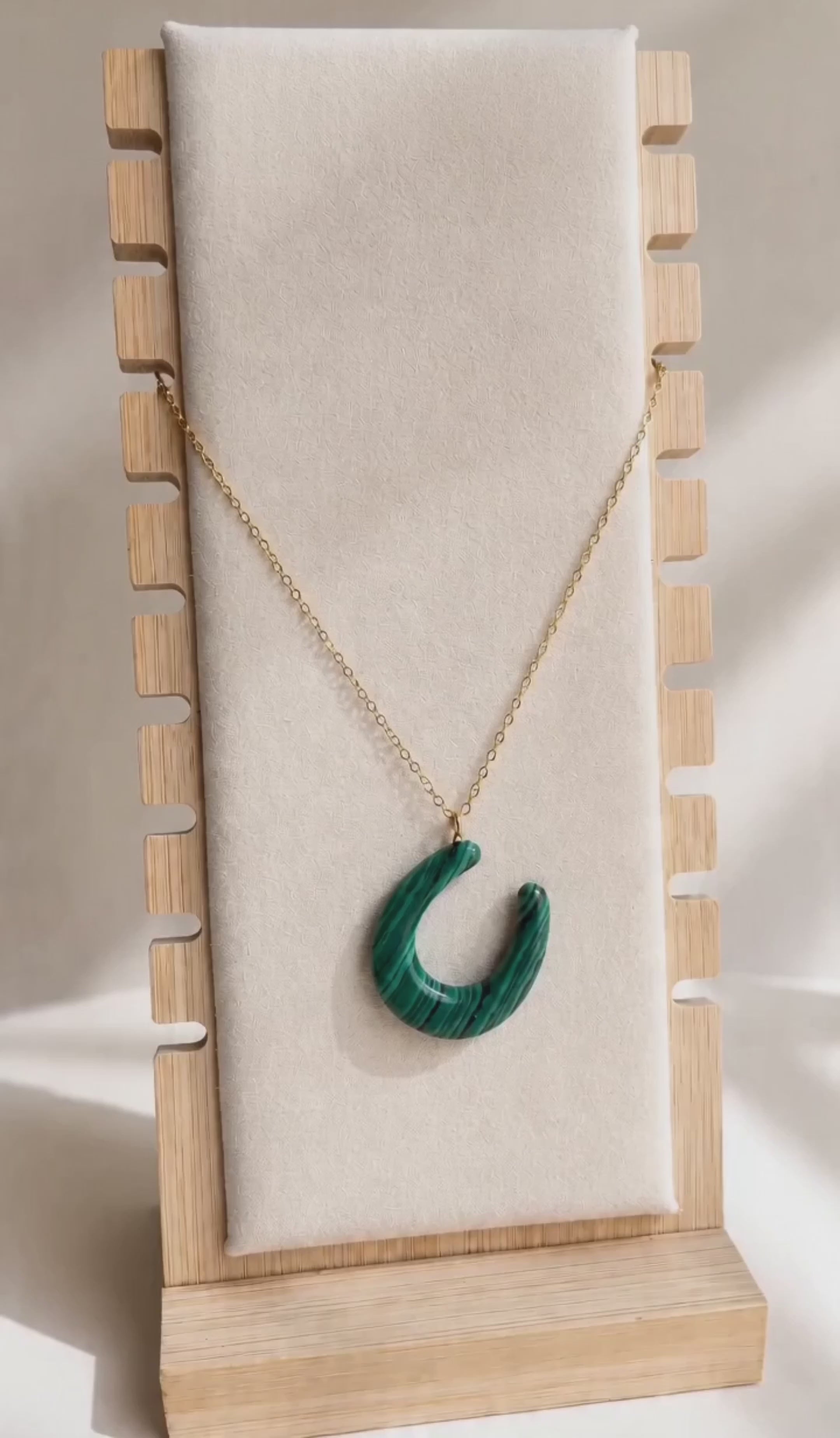 Malachite gemstone necklace with an 18K gold-plated chain.