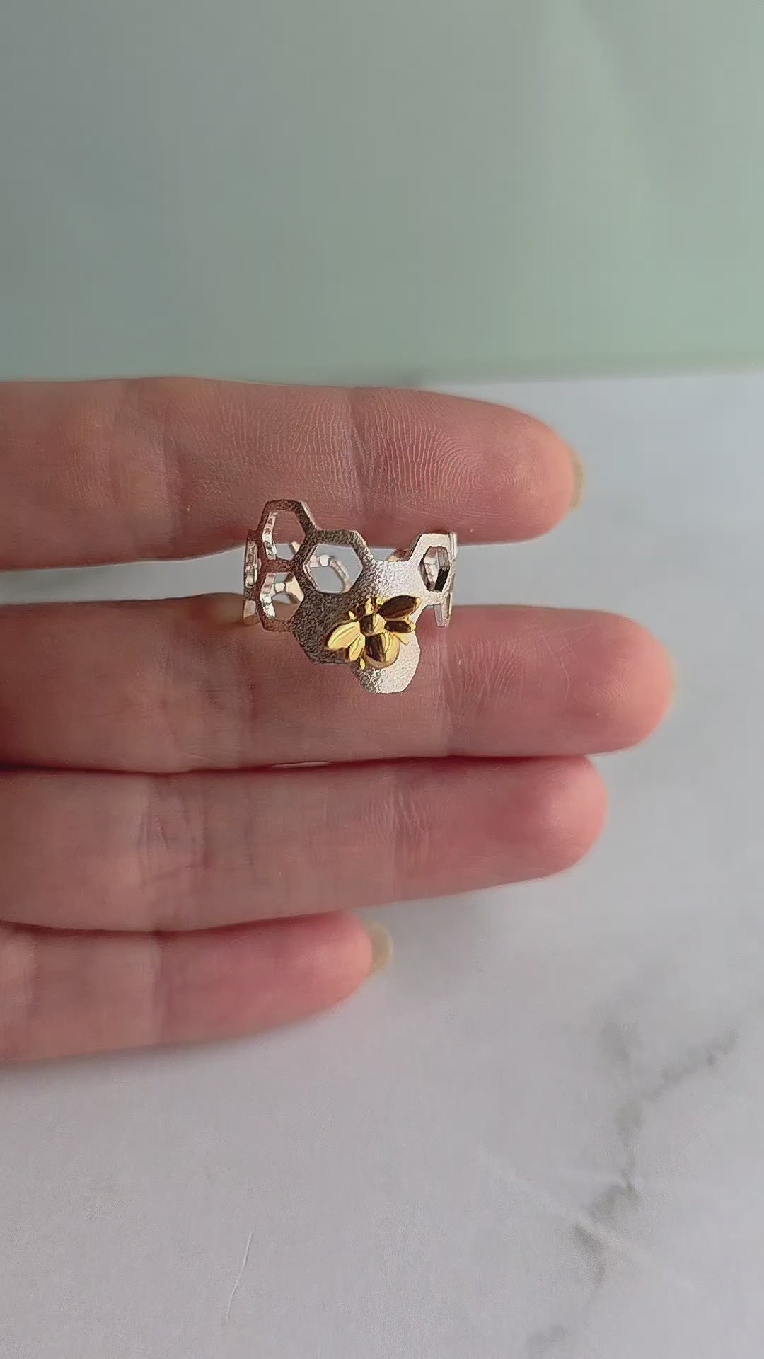 Statement bee ring with gold bee accent.