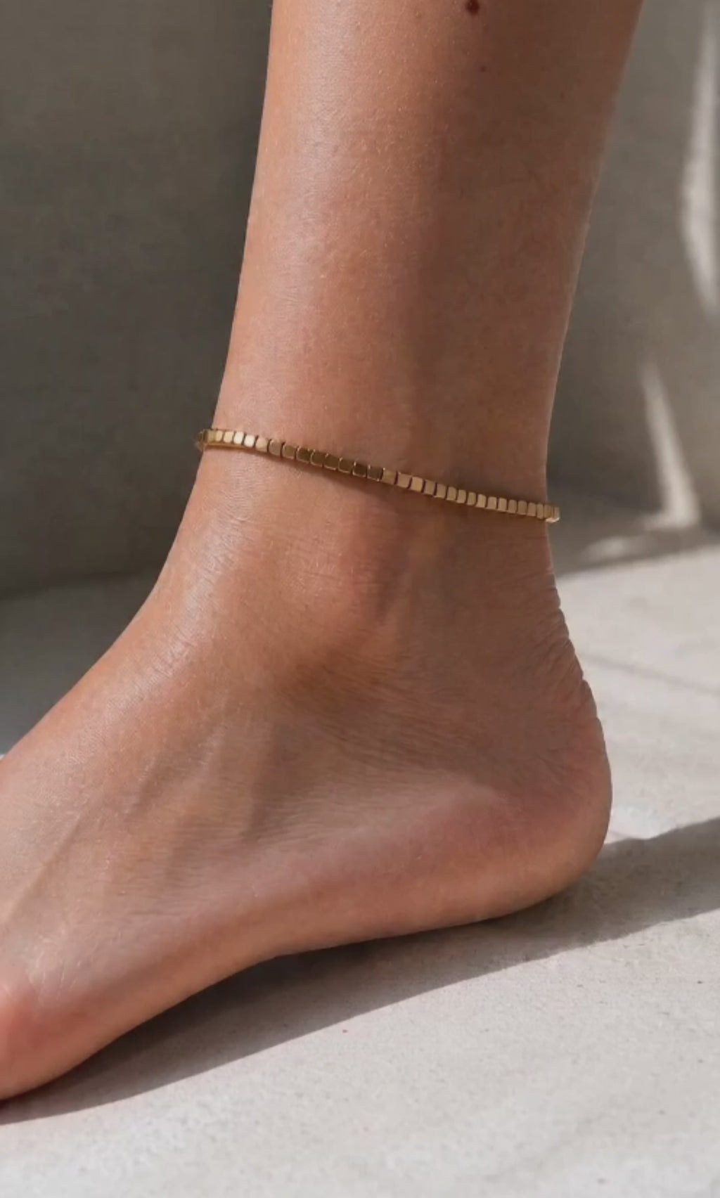 Minimalist beaded anklet available in gold and silver finishes.