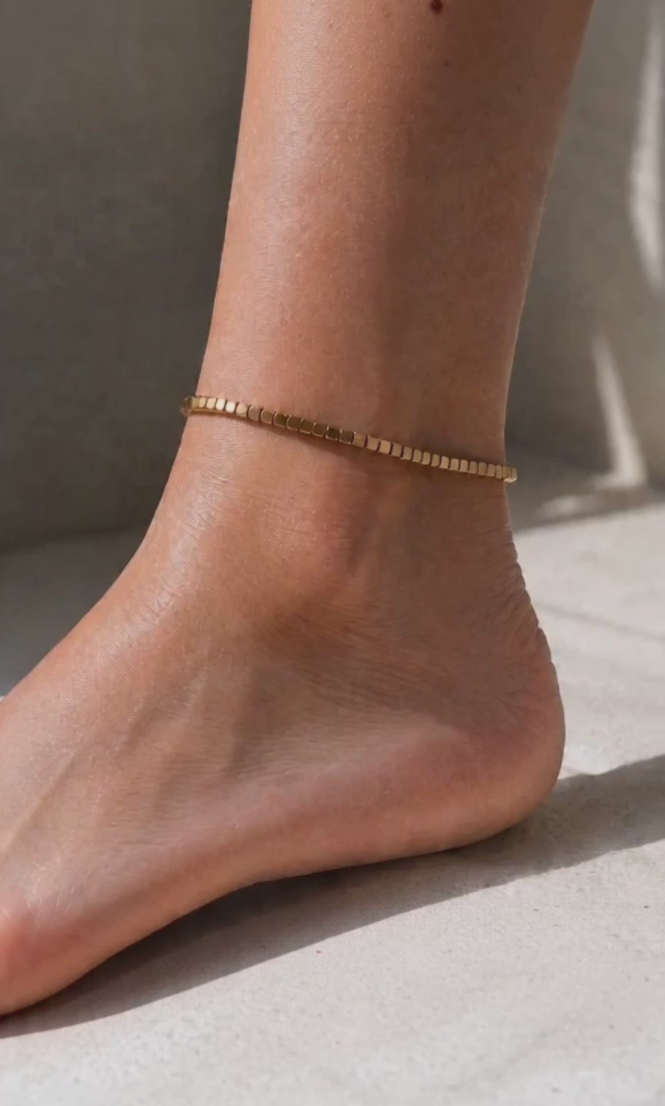 Minimalist beaded anklet available in gold and silver finishes.