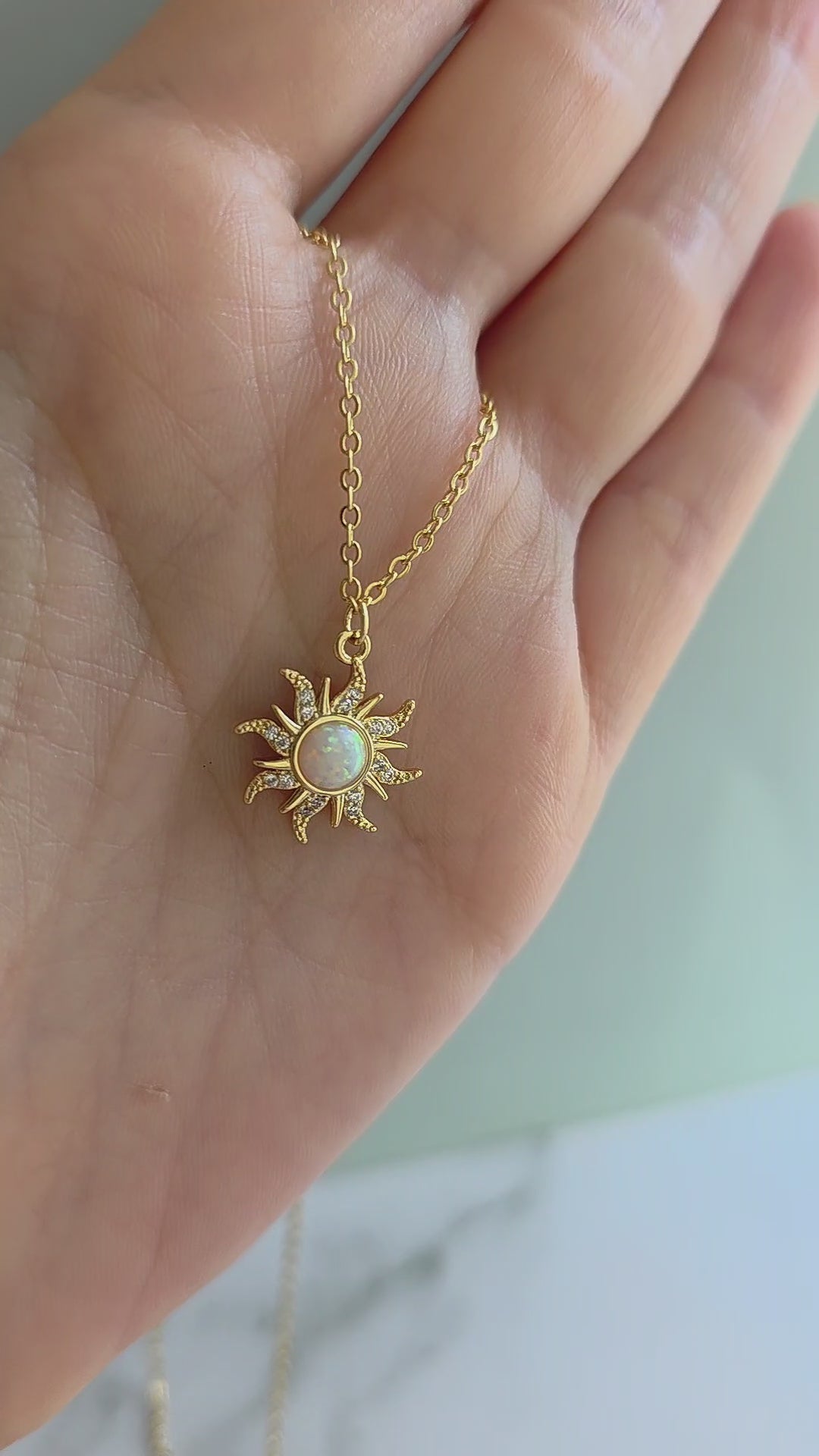 Minimalist sun necklace with an opal stone.